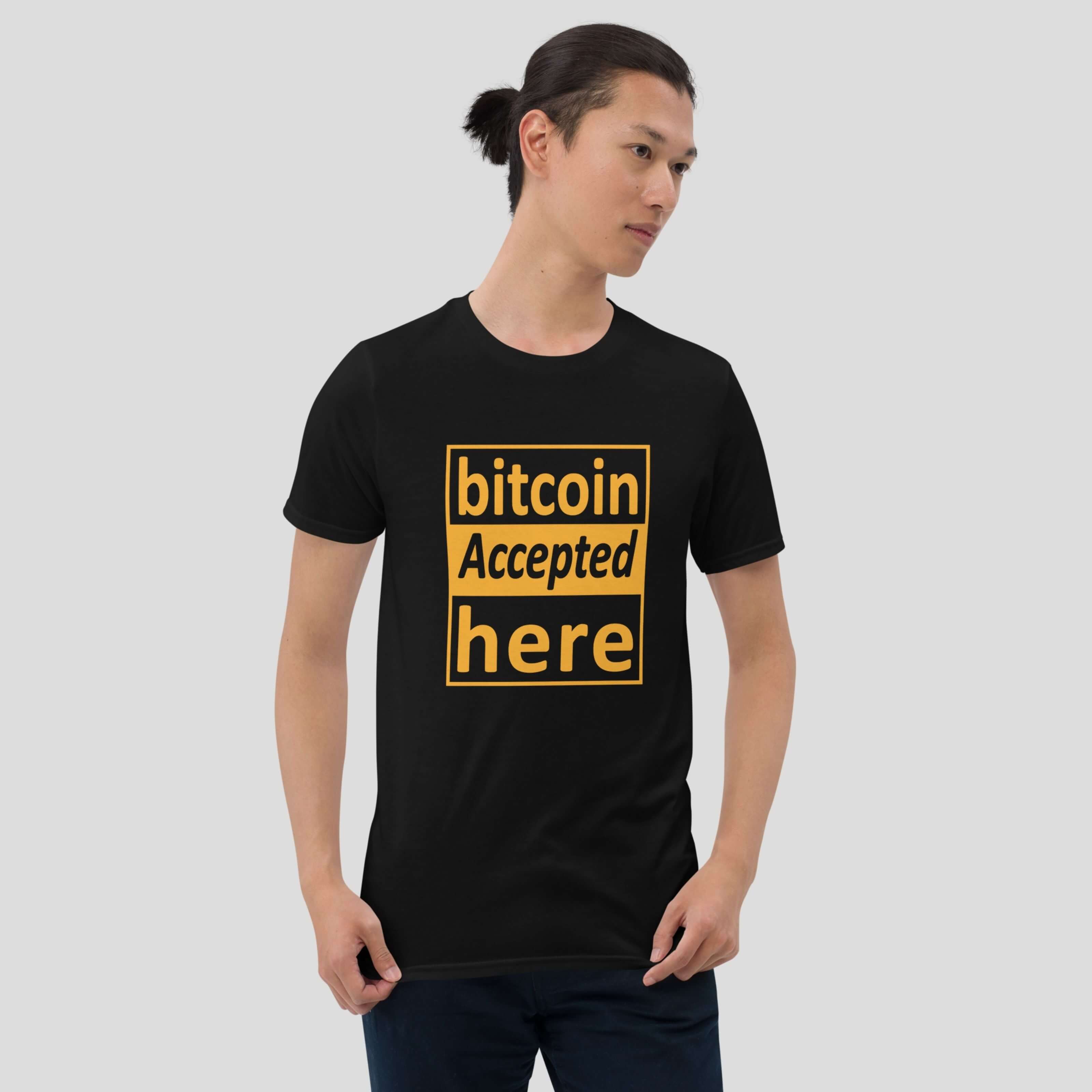 Male model posing with a bitcoin payment accepted graphic t-shirt