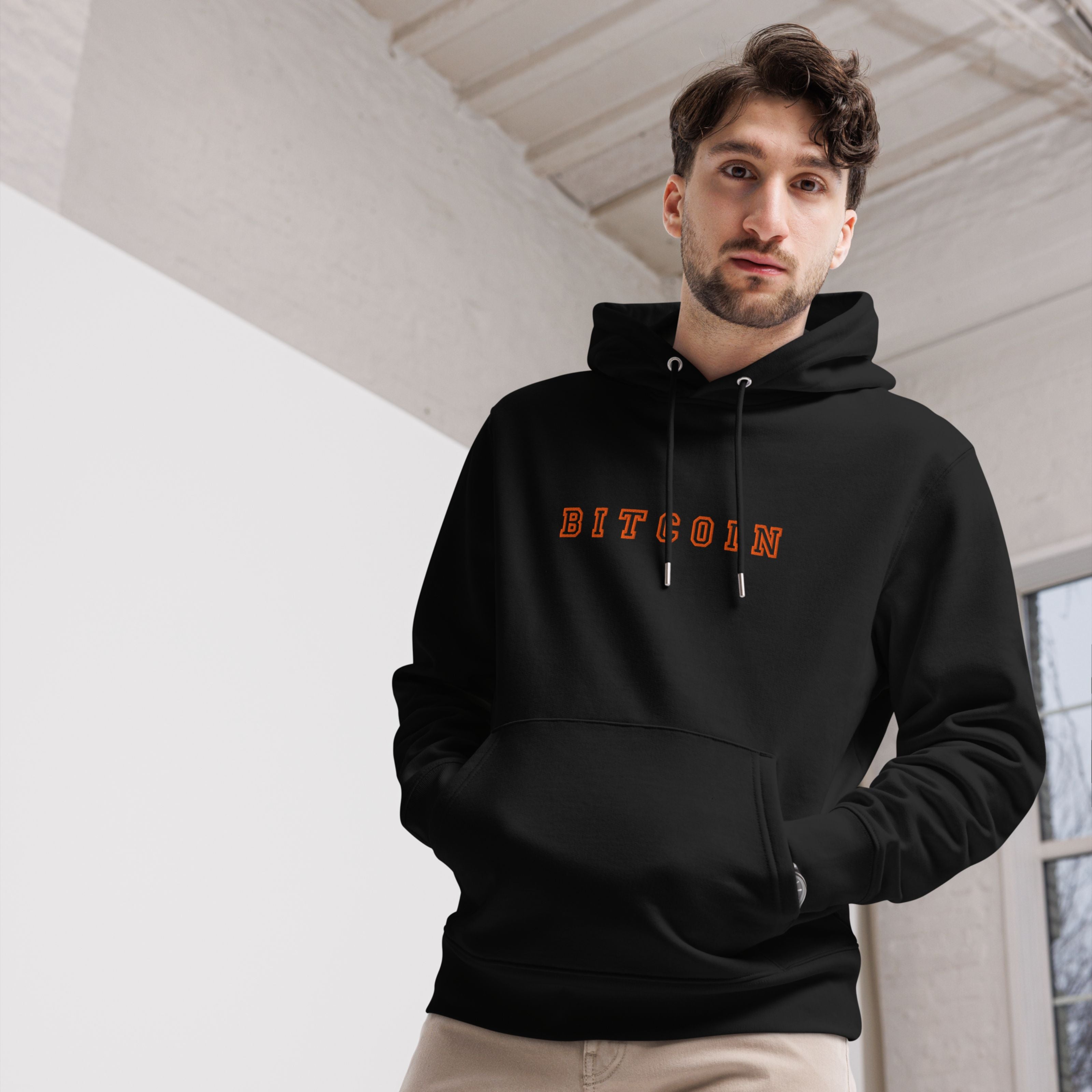 man wearing black bitcoin hoodie crypto streetwear outfit