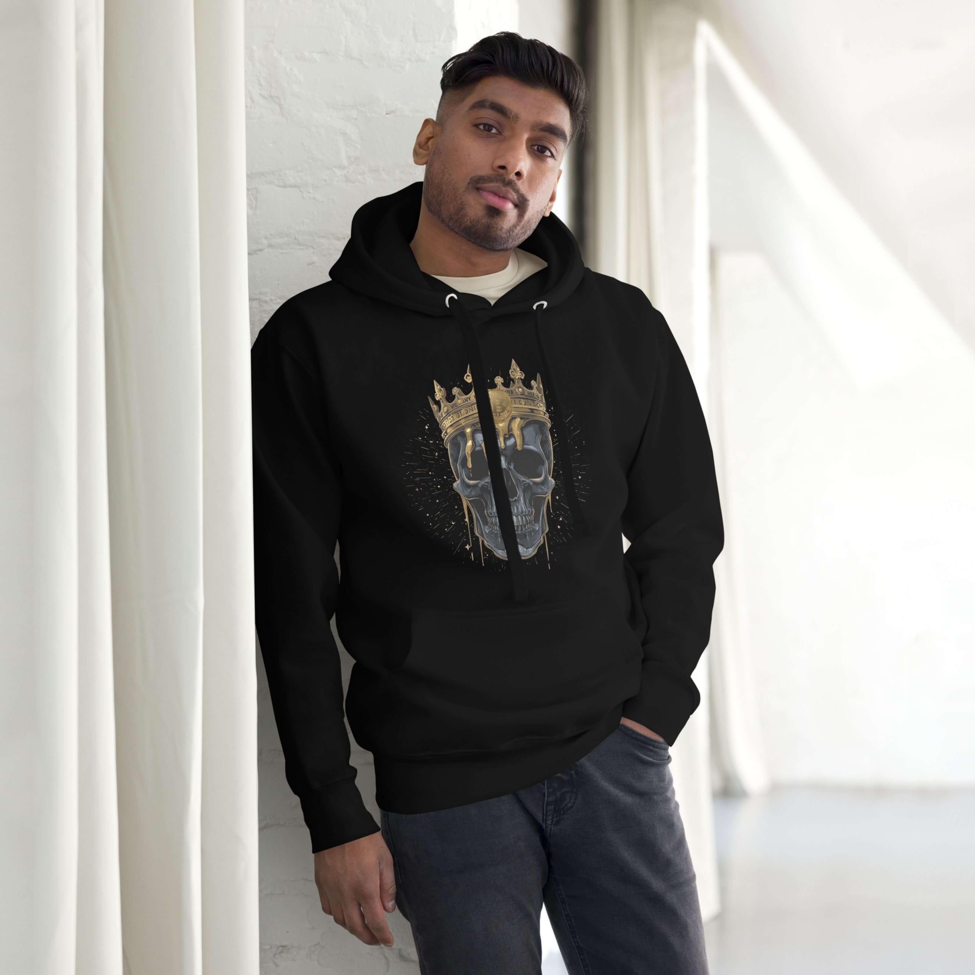 Black bitcoin skull king crown hoodie with gold melting crown worn by a model