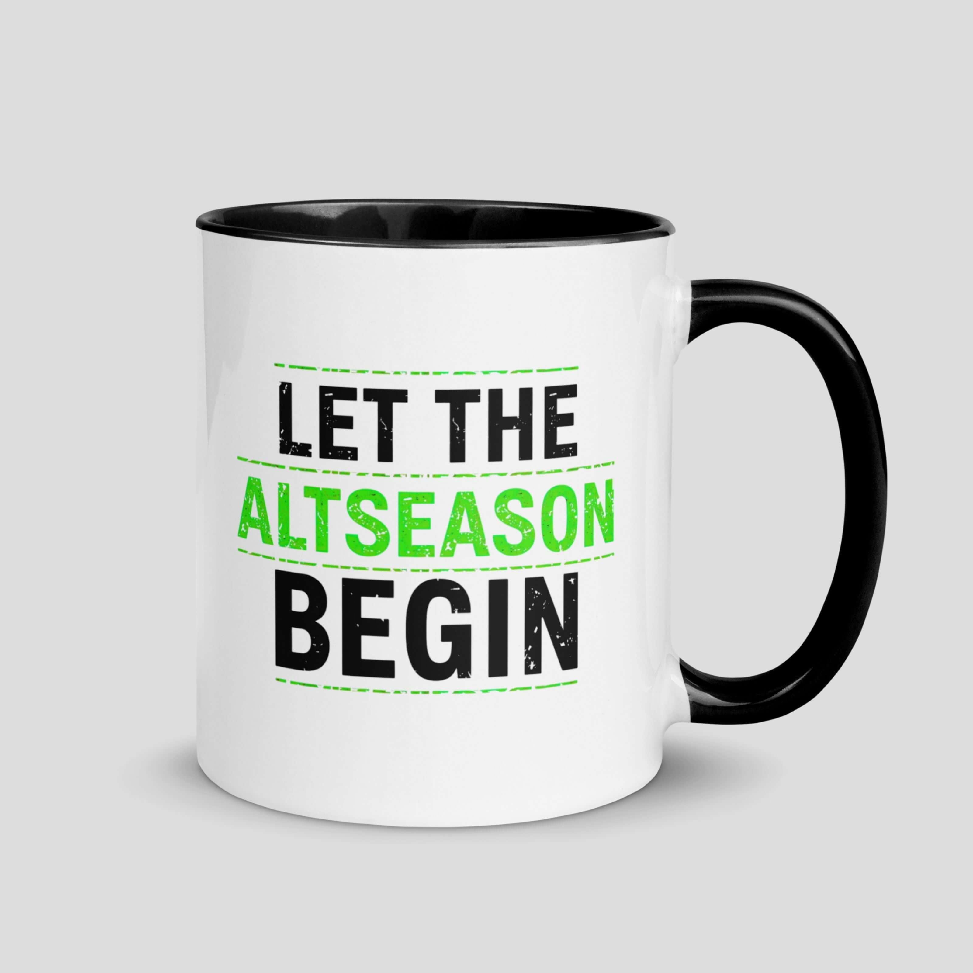 White ceramic mug with Let the Altseason Begin text in green and black crypto typography