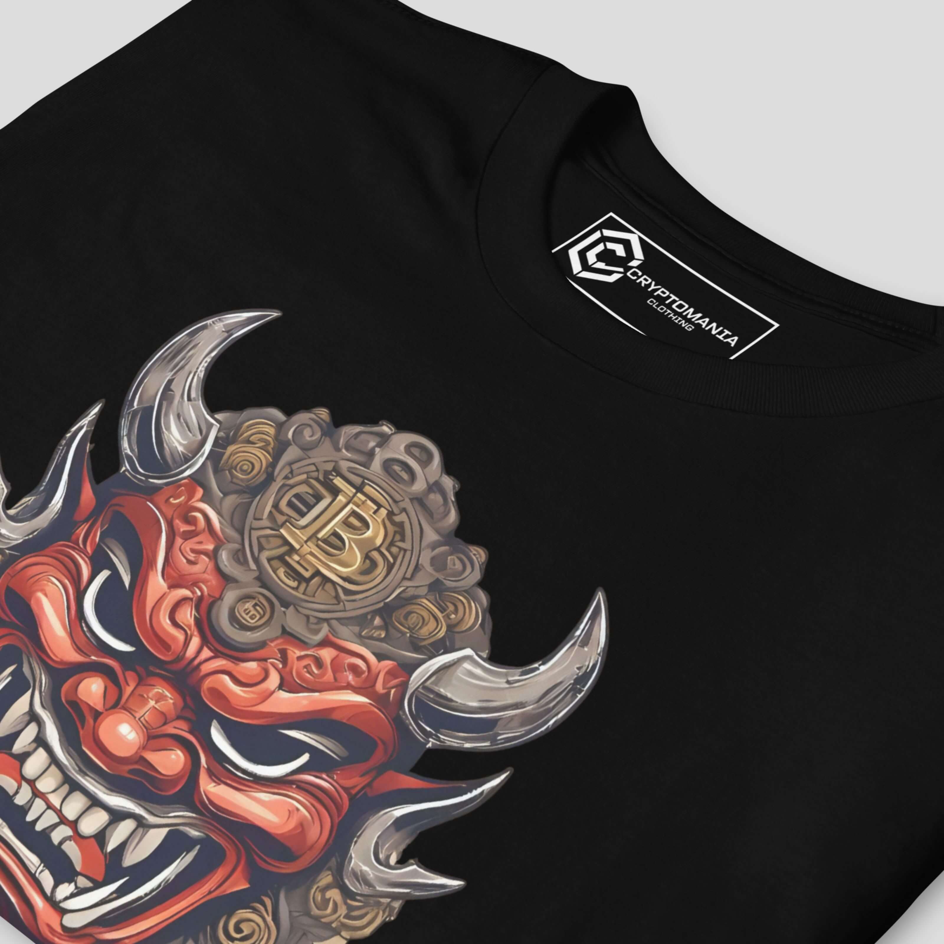 Close-up of oni mask illustration on black crypto t-shirt showing intricate artwork, bold colors, and streetwear style details