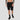 Solana crypto shorts shown on a model at the gym, black colourway lifestyle view