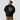 Model wearing the black XRP Superhero Hoodie, showing the relaxed unisex fit